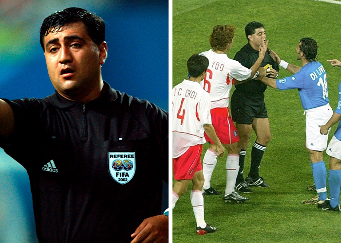 FIFA referee officiating and players disputing in World Cup match