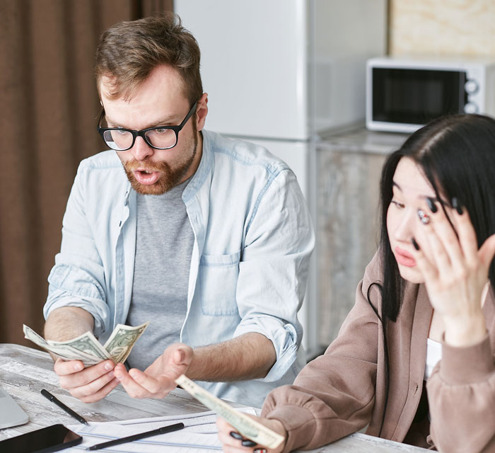Couple arguing over money showing gross relationship issues