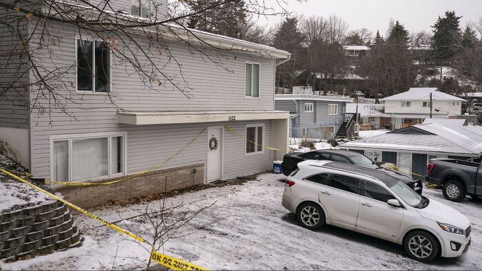 Crime scene outside house with police tape in Bryan Kohberger investigation