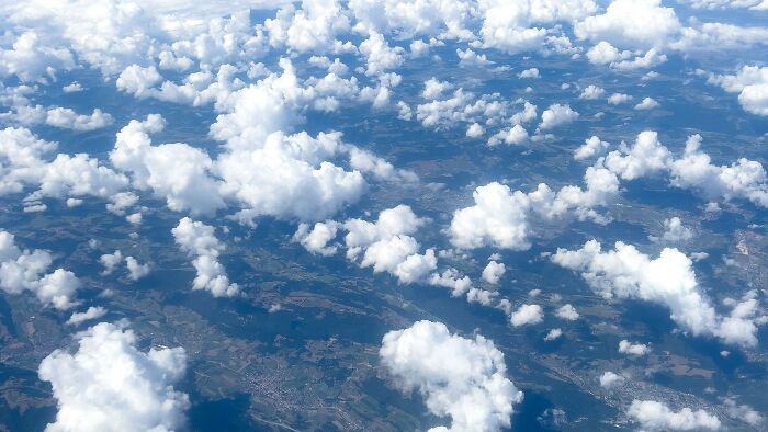 Aerial view of clouds and land representing perspective in mind-bending dilemmas