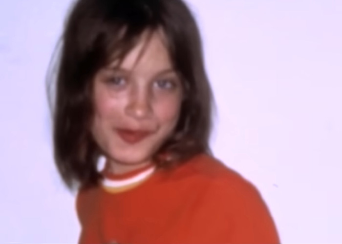 A girl abandoned by parents, now smiling with short hair and an orange shirt, a glimmer of hope. A girl abandoned by parents, now smiling with short hair and an orange shirt, a glimmer of hope.