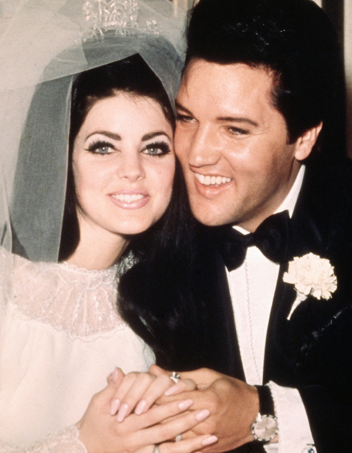 Vintage wedding photo of music idols with significant age gap holding hands and smiling
