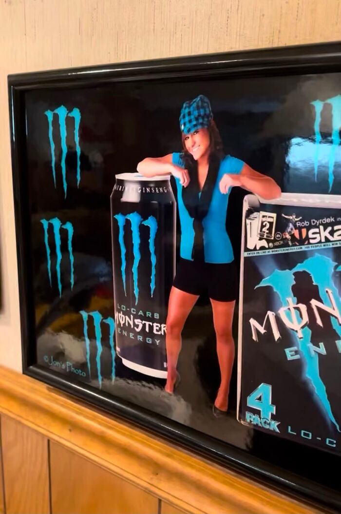 Framed Monster Energy artwork featuring a woman and energy drink cans