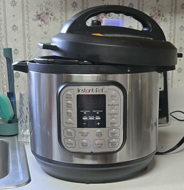 An Instant Pot Duo pressure cooker on a kitchen counter, showcasing its digital display and various cooking functions for Prime Day Deals.