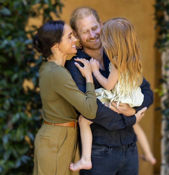 Meghan Markle and Prince Harry lovingly embrace their daughter, sparking parenting concerns over the Father's Day photo detail. Meghan Markle and Prince Harry lovingly embrace their daughter, sparking parenting concerns over the Father's Day photo detail.