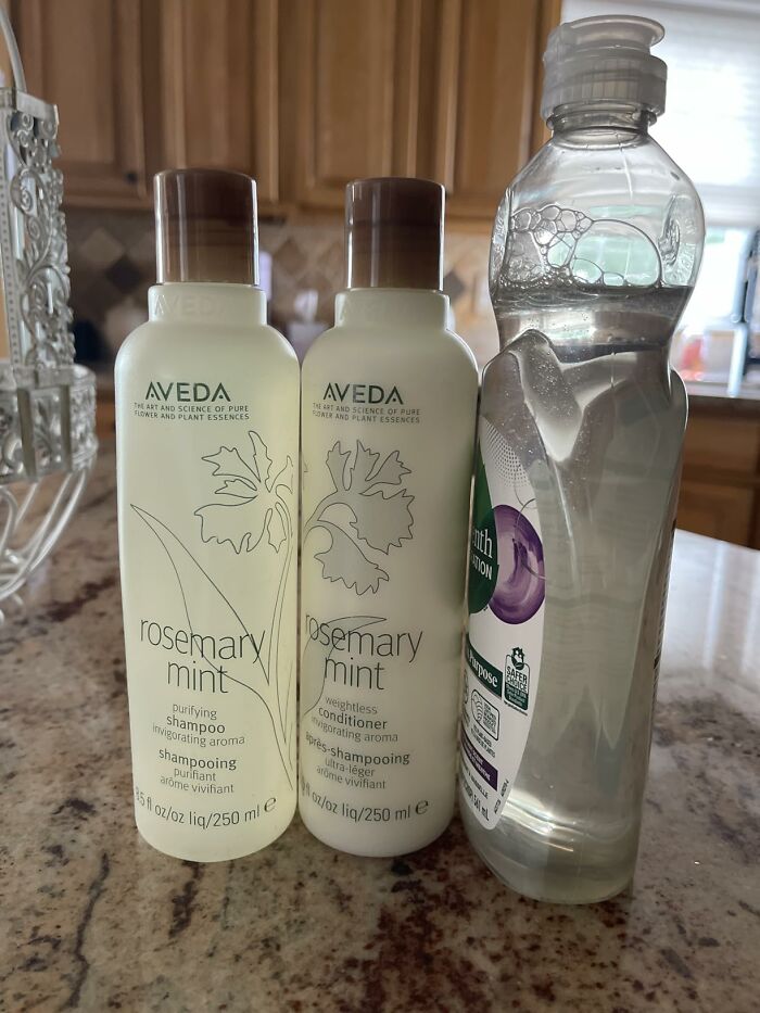 Three bottles of hair care products and dish soap, showcasing Prime Day Deals on home essentials.