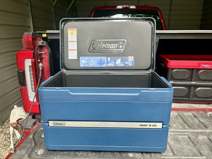 A blue Coleman Snap 'N' Go cooler in the back of a truck, an essential for outdoor summer adventures and Prime Day.