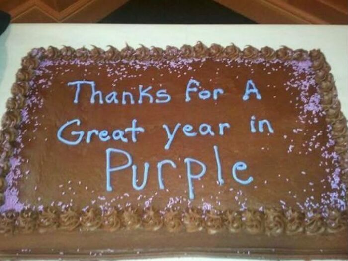 Funny cakes: A cake with the inscription Thanks For A Great year in Purple, showing a decorator mess up.