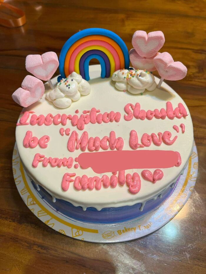 Funny cakes: A white cake with a rainbow and pink hearts, inscribed with decorator instructions instead of the message.