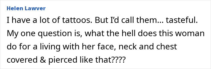 Most tattooed woman with extensive face, neck, and chest tattoos and piercings