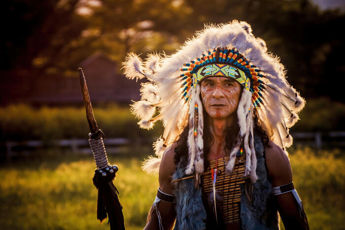 Native American man in traditional headdress symbolizing family secrets
