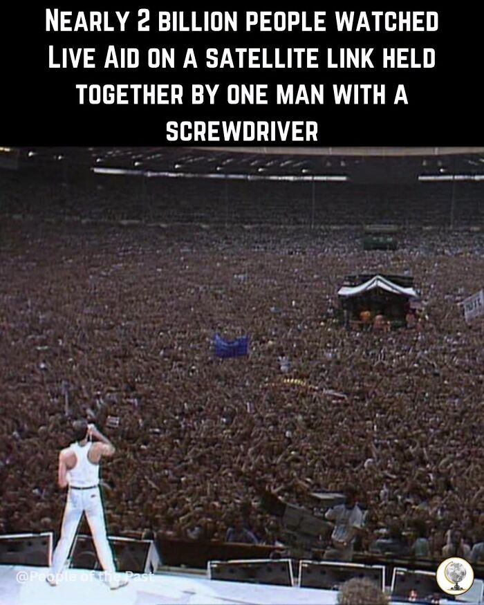 An aerial view of a massive crowd at Live Aid, featuring Freddie Mercury on stage, a historical post.