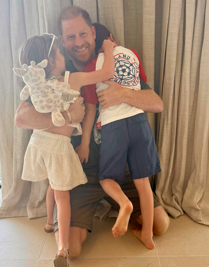 Prince Harry hugging his kids, Lilibet and Archie, on Father's Day, intensifying concern for the children. Prince Harry hugging his kids, Lilibet and Archie, on Father's Day, intensifying concern for the children.