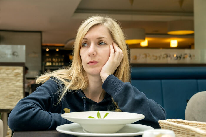 Woman looking away thoughtfully representing unhinged relationship excuses