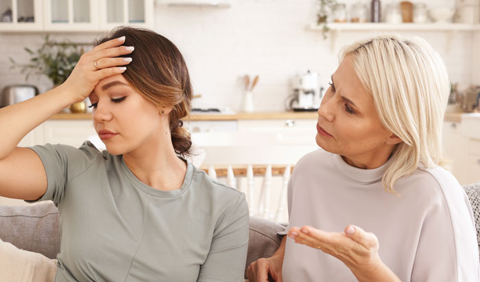 Pregnant woman having contractions, stressed by mother-in-law refusing to leave her home.