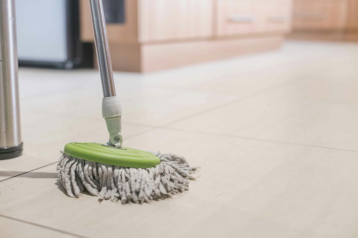 Dirty mop on kitchen floor illustrating gross habits in relationships
