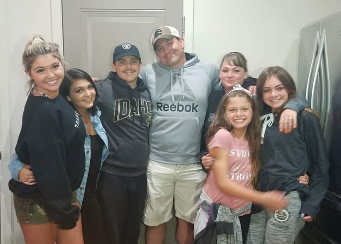 Group photo of Bryan Kohberger's victims smiling together indoors