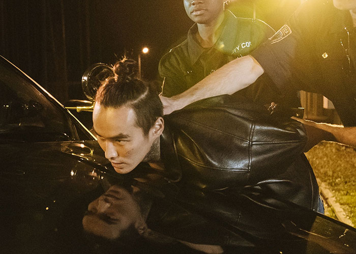 A popular kid who peaked in high school being arrested by cops at night.