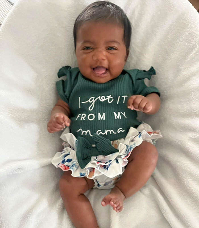 Adorable baby in a green onesie, born to the wrong parents after an IVF mix-up. Adorable baby in a green onesie, born to the wrong parents after an IVF mix-up.