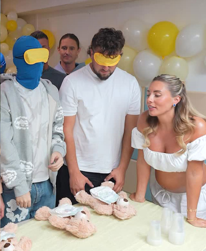 Bonnie Blue engaging in a baby shower game with blindfolded guests, a fun activity for the baby shower.