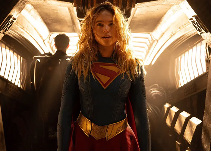 Supergirl fans see Supergirl in her iconic blue and red costume, standing heroically in a futuristic setting.