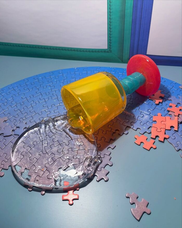 Spilled hyper-realistic glass food drink, an artist's creation, on a puzzle, looking good enough to eat.