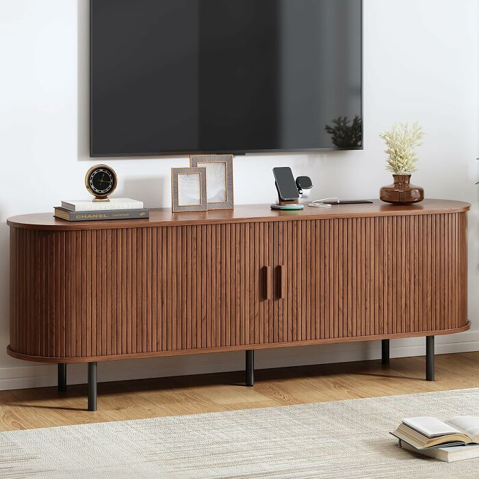 A modern wooden TV stand with fluted doors, a top Prime Day deal for home entertainment.