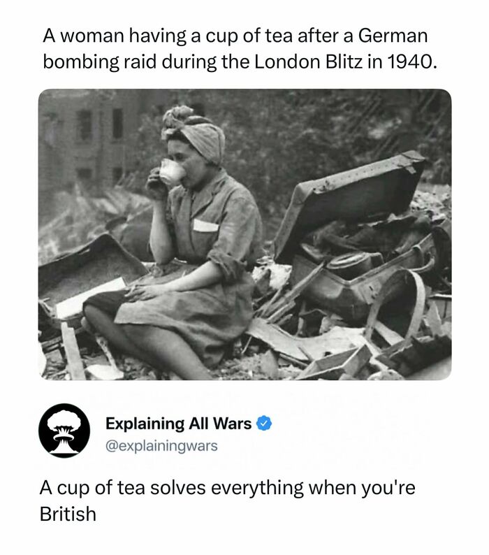 A woman calmly drinking tea amidst rubble after a German bombing raid during the London Blitz, explaining all wars.
