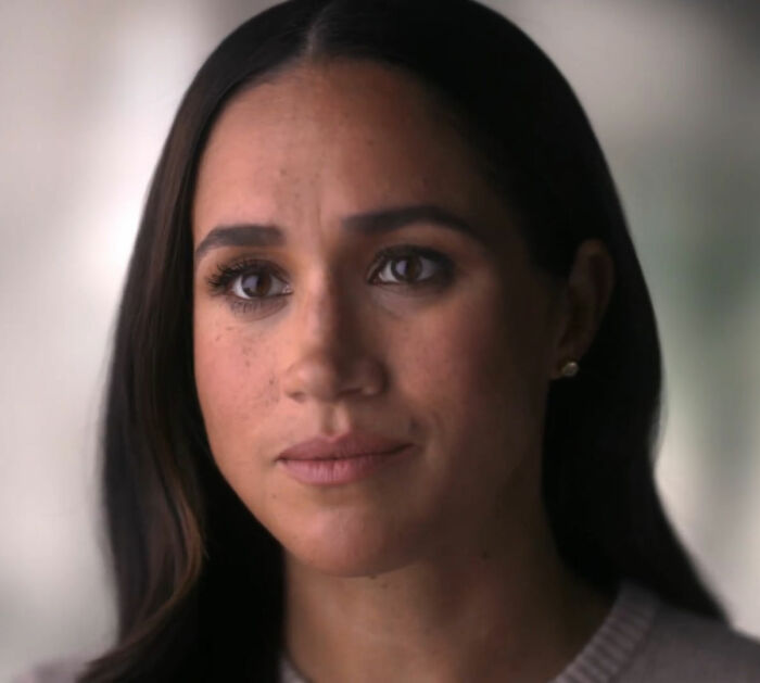Close-up portrait of Meghan Markle with a serious expression Close-up portrait of Meghan Markle with a serious expression