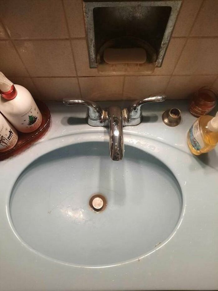 A bathroom sink faucet installed backward, a ridiculous you had one job fail showing common sense isn't common.