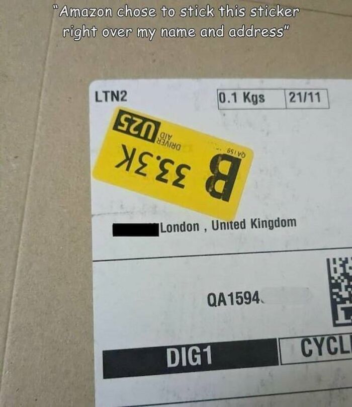 An Amazon package with a large yellow sticker covering the recipient's name and address, showing an Amazon fail.
