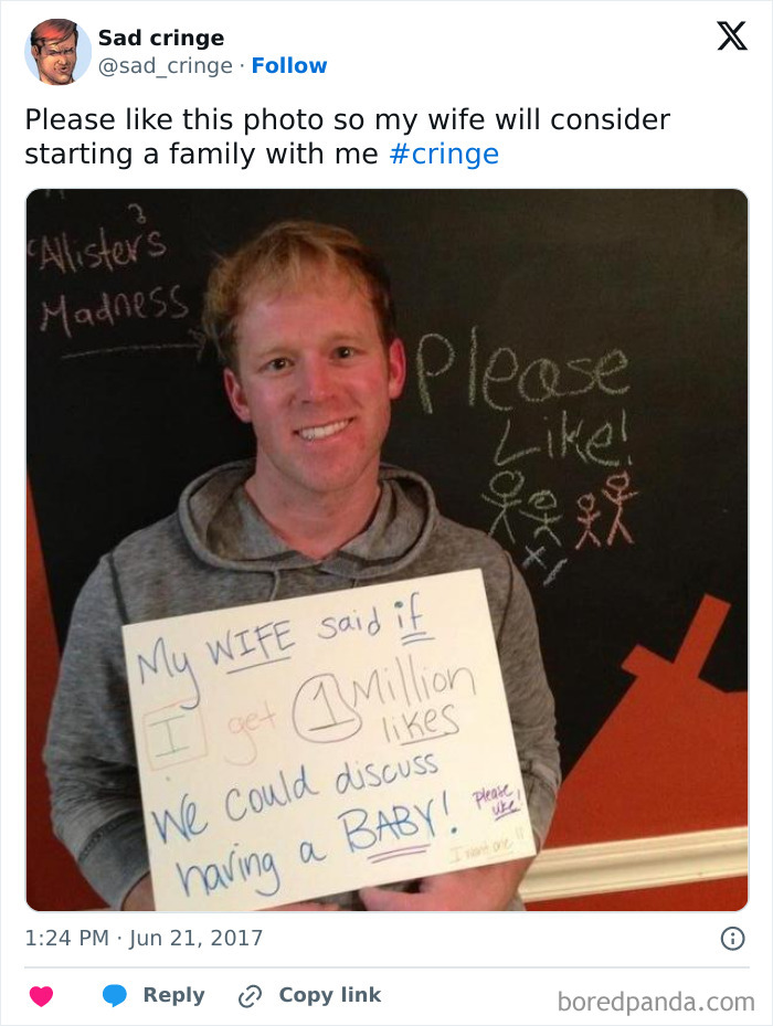 A man holding a sign that says, My wife said if I get 1 million likes we could discuss having a baby!, which is incredibly sad.