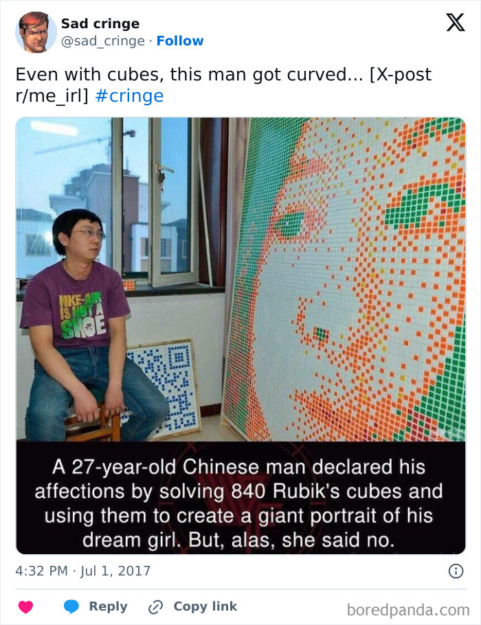 A man next to a large Rubiks cube mosaic. This cringy effort to win over a girl was incredibly sad as she said no.