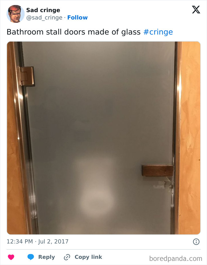A cringy bathroom stall with transparent glass doors, offering no privacy to the user. An incredibly sad design choice.