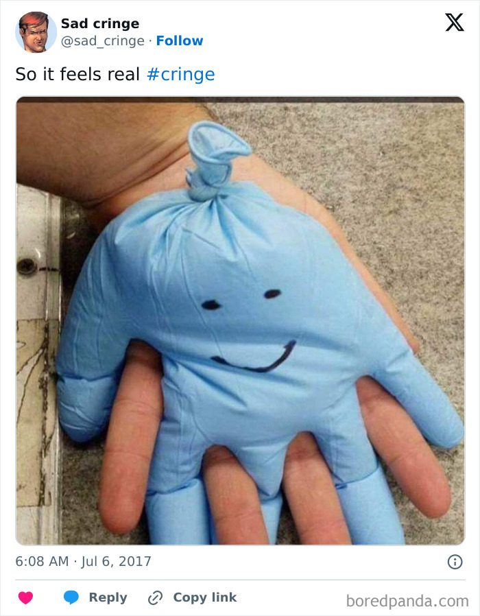 A blue rubber glove inflated and drawn to look like a face, held in a hand, shared on Twitter as incredibly cringy and sad.