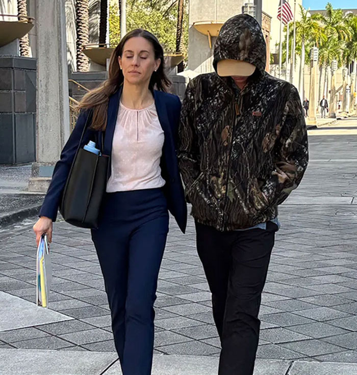 Woman and man walking with hands in pockets in violent case report
