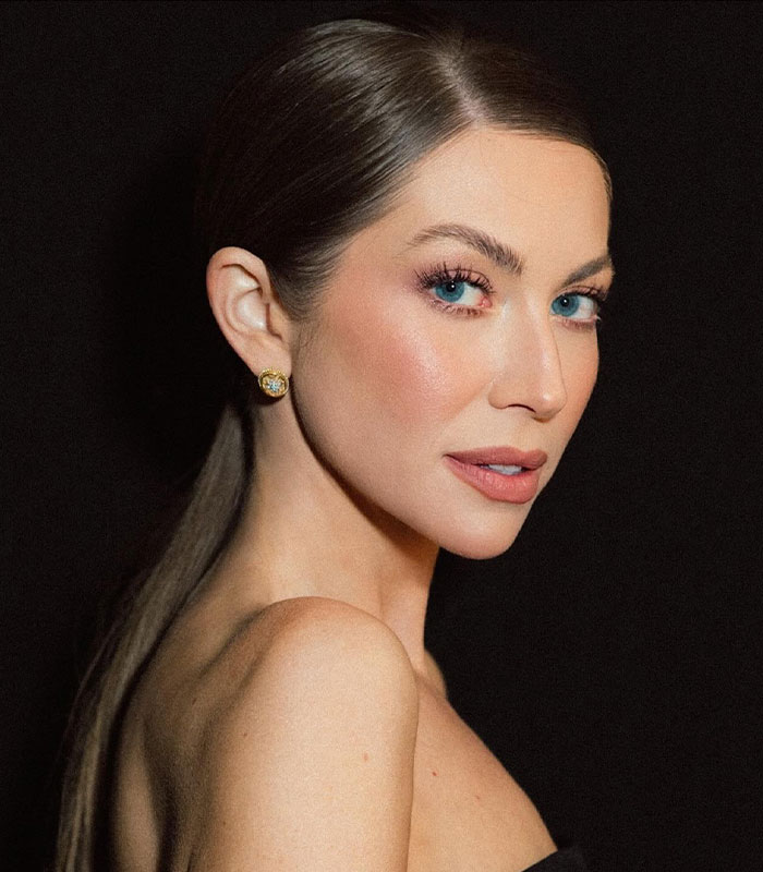 Close-up portrait of model with makeup and earrings Close-up portrait of model with makeup and earrings