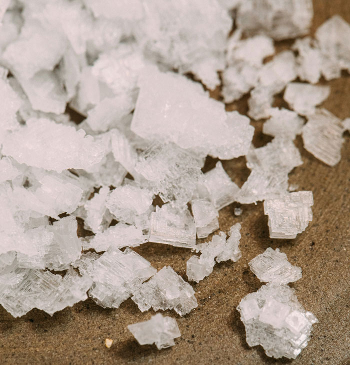 Close-up of sea salt flakes crystals on surface