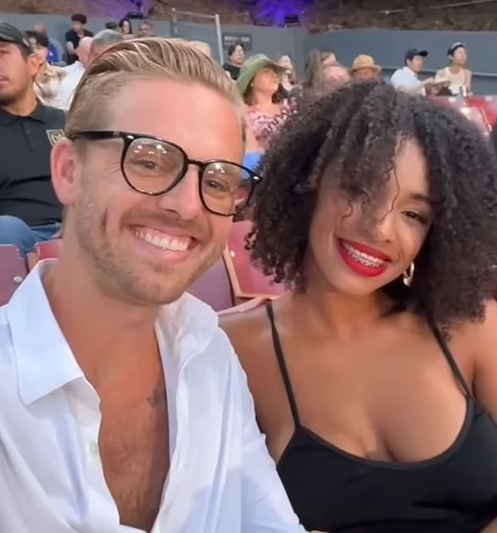 California housewife and man smile together at event California housewife and man smile together at event