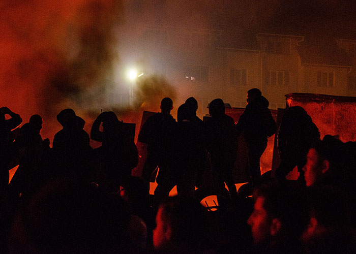 Silhouettes of people in a smoky, fiery setting, illustrating the challenging nature of advice that is good but socially not acceptable.
