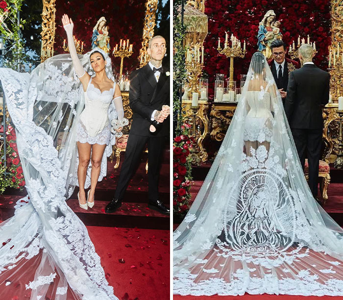 Kourtney Kardashian's unique celebrity wedding dress and veil with a religious icon, standing with Travis Barker.