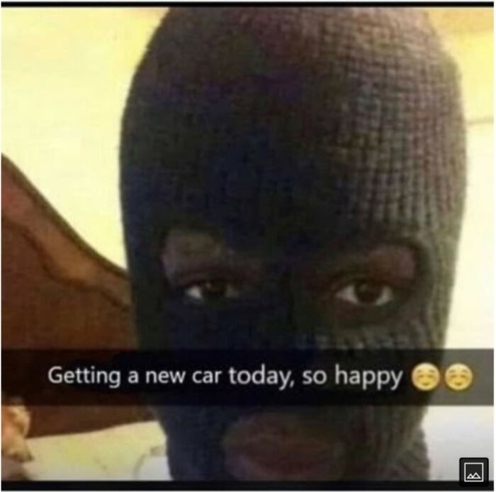 A blursed meme of a person wearing a ski mask, smiling, with the caption Getting a new car today, so happy.