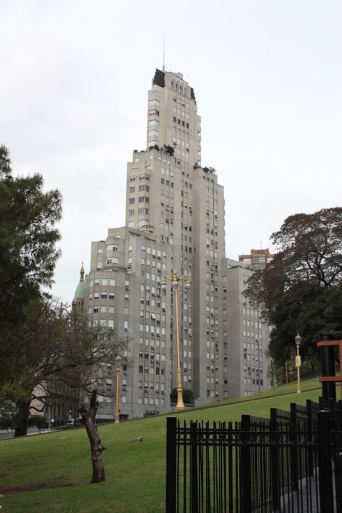 Historic brutal revenge acts symbolized by a tall old city building and park