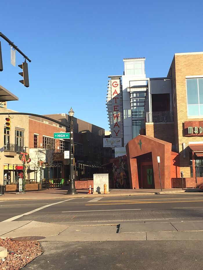 A sunny street scene with the Gateway sign visible, hinting at unsolved mysteries in urban spaces.