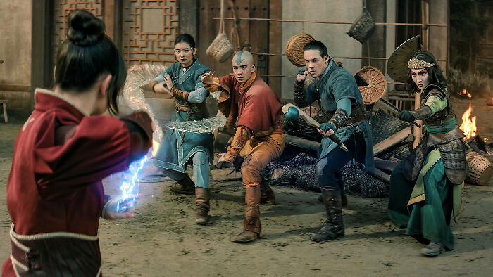 Characters from a major Netflix show engaging in a fight scene, amid casting controversy and hidden bias.