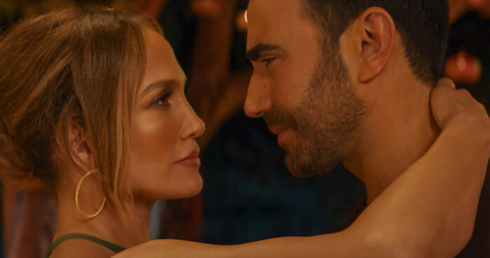 Jennifer Lopez and co-star embracing romantically in Office Romance Jennifer Lopez and co-star embracing romantically in Office Romance