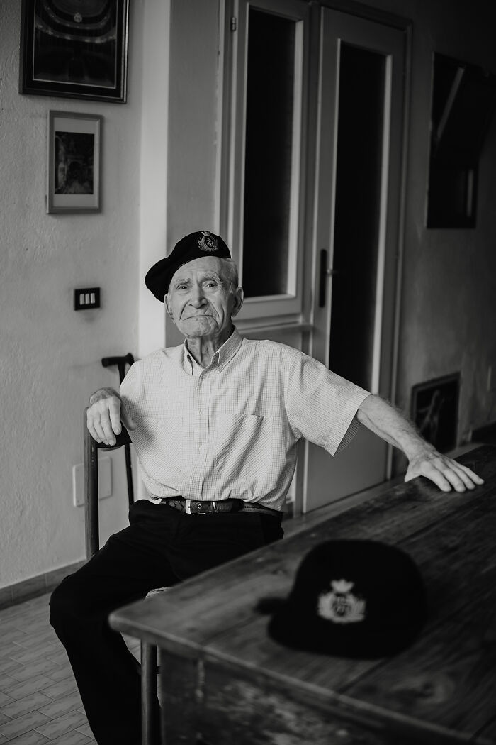 Black and white portrait of elderly man in beret showing raw beauty of human spirit