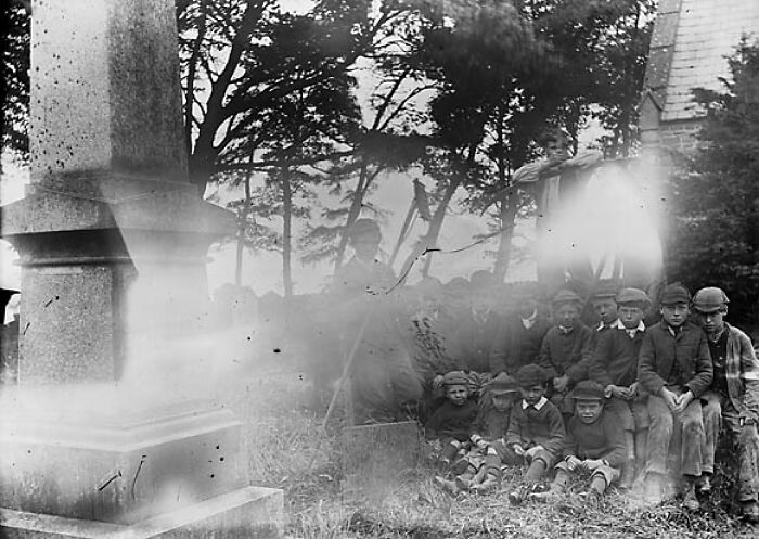 A Group Of Boys In The Churchyard