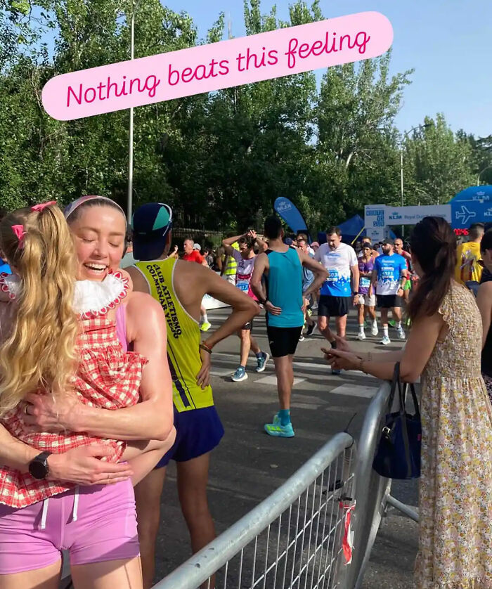 Amber Heard embraces a child, happy in her new life and new country after fleeing Hollywood. Amber Heard embraces a child, happy in her new life and new country after fleeing Hollywood.
