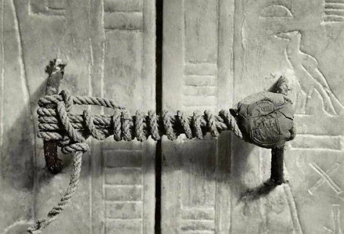 Ancient door with rope handle and hieroglyphs historic treasure